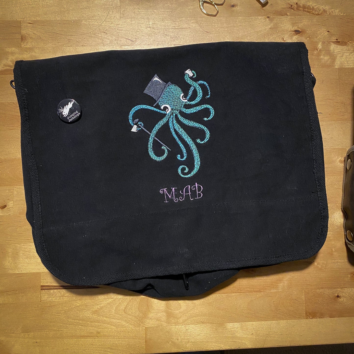 Dapper Octopus Embroidered Canvas Messenger Bag